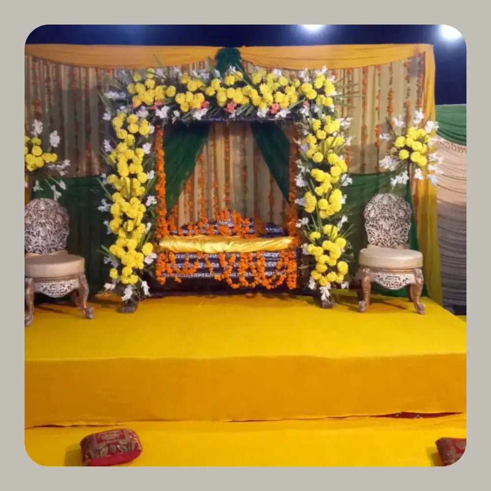Traditional Green and Yellow Mehndi Jhoola Stage with Marigold Arch