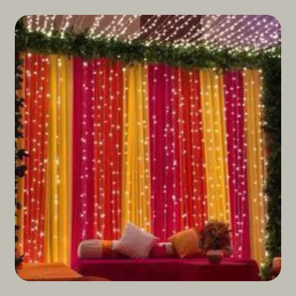 Colorful Fabric Draping Mehndi Backdrop with Fairy Light Strings