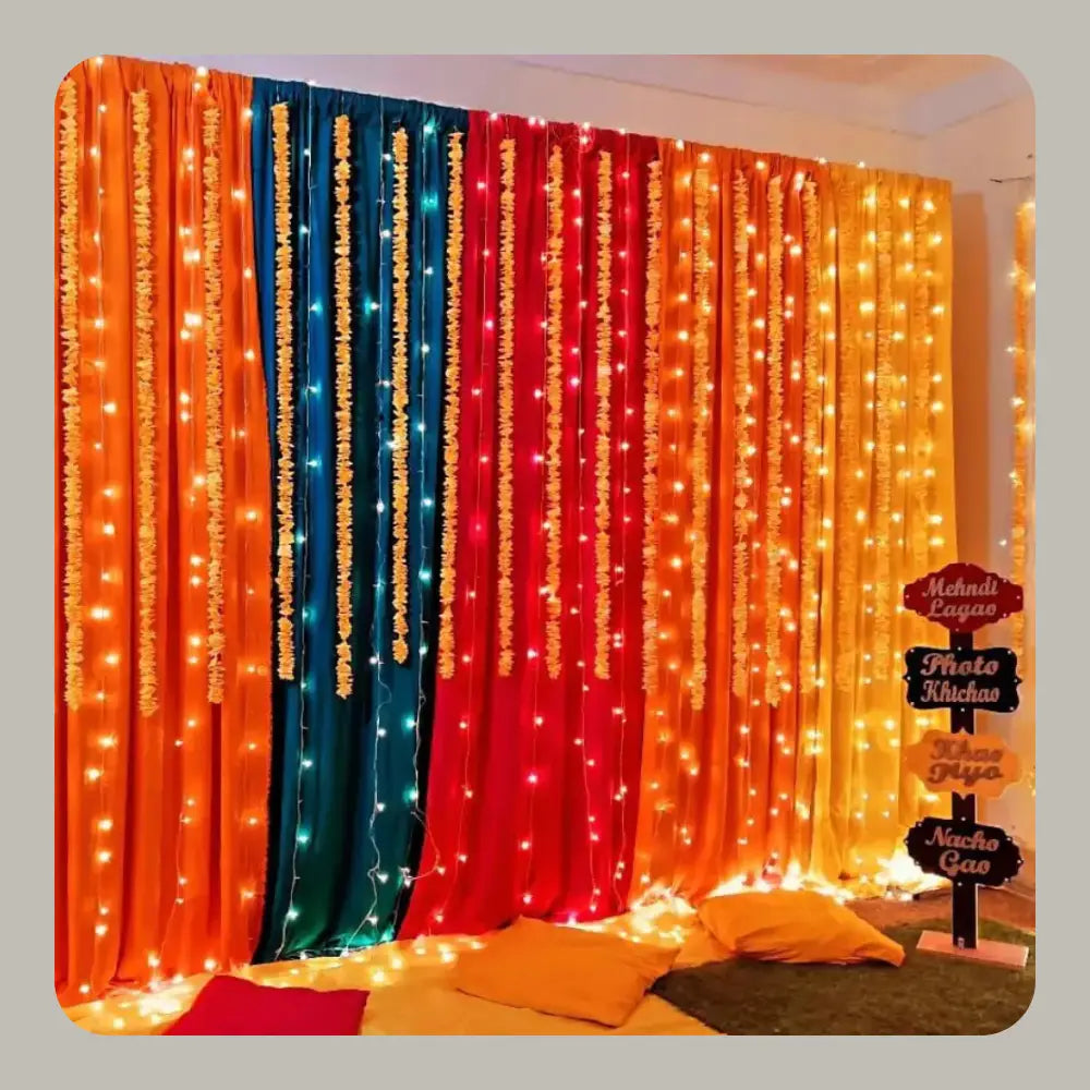 Multicolor Fabric Backdrop Mehndi Decor with Fairy Lights and Fun Signage