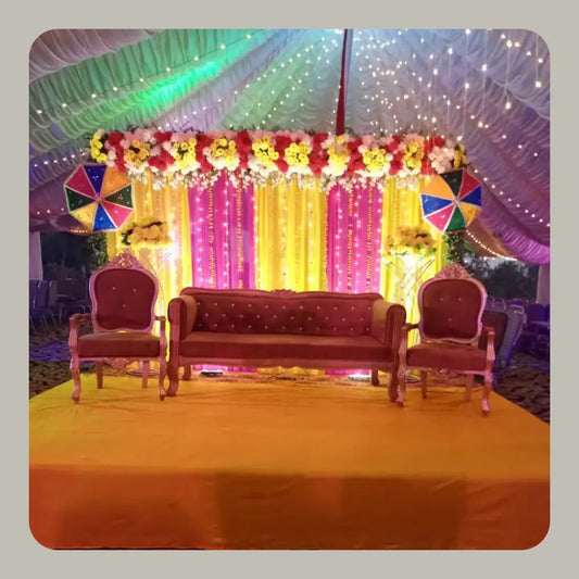 Elegant Mehndi Stage Decor with Marigold Backdrop and Fairy Light Canopy