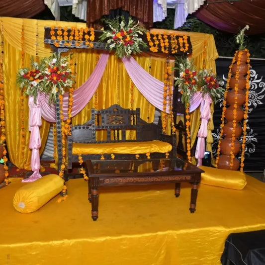 Traditional Wooden Jhoola Mehndi Stage with Yellow Marigold Decor
