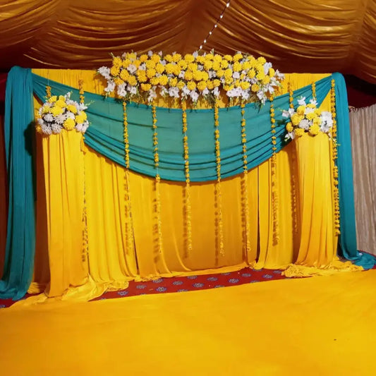 Elegant Yellow and Teal Mehndi Backdrop with Floral Header and Marigold Strings