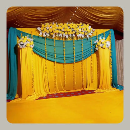 Elegant Yellow and Teal Mehndi Backdrop with Floral Header and Marigold Strings