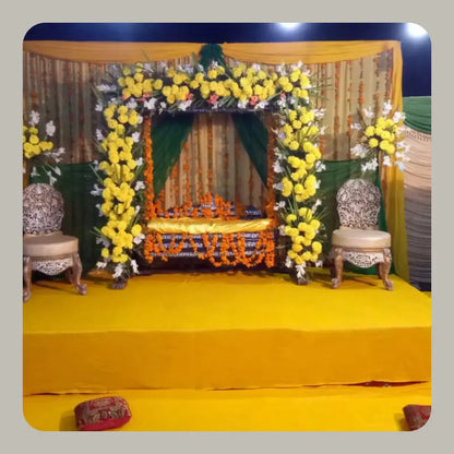 Traditional Green and Yellow Mehndi Jhoola Stage with Marigold Arch