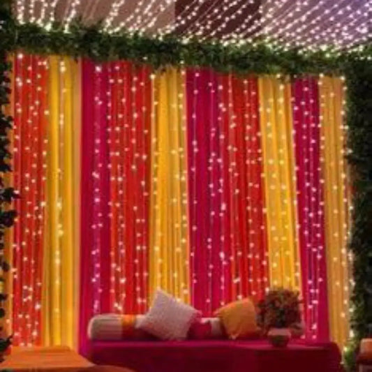 Colorful Fabric Draping Mehndi Backdrop with Fairy Light Strings