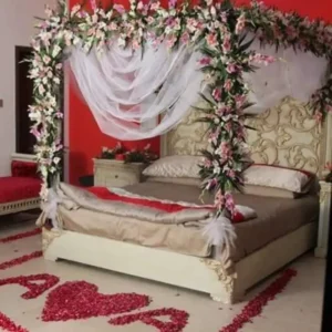 Bridal Room Decoration with Pink and White Floral Canopy, Tulle Drape and Rose Petal Heart